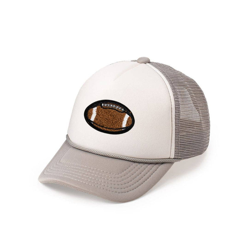 The&nbsp;Football&nbsp;Patch Trucker Hat&nbsp;for kids is a fun and trendy accessory for celebrating Game Day! Features: * Hat Color:&nbsp;Gray/White * Patch&nbsp;Color:&nbsp;Brown&nbsp;and&nbsp;white chenille with&nbsp;black outline * Material: Foam/Mesh * Features: Adjustable snap back closure fits 45-56cm * Size: Recommended for ages 4+ Each hat&nbsp;is hand pressed with love&nbsp;in our hometown warehouse.