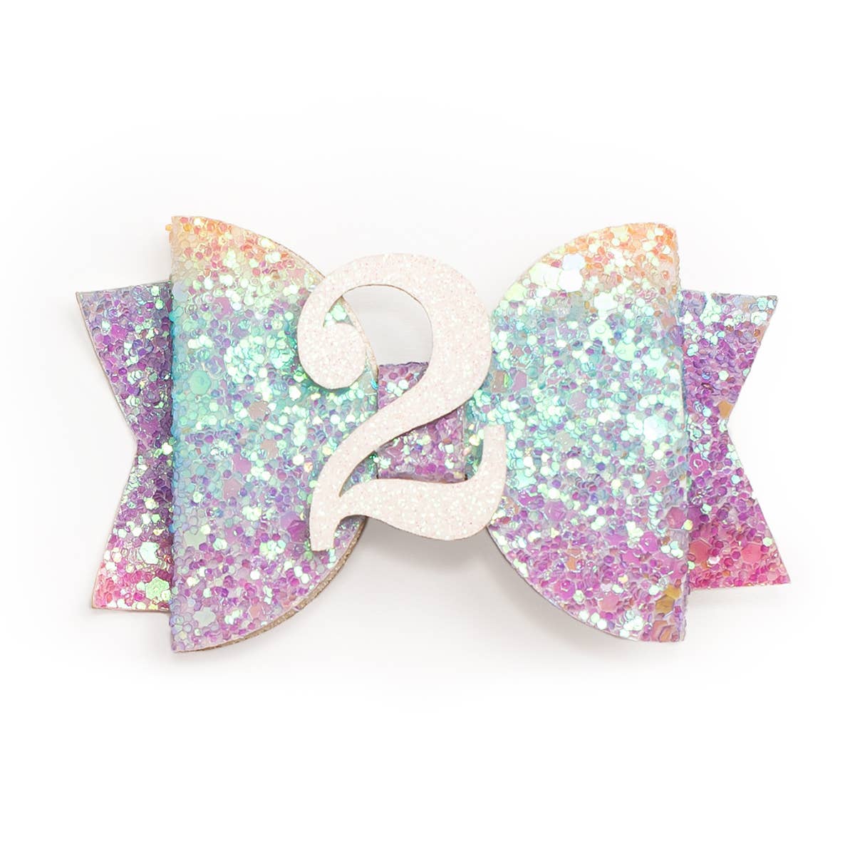 Every little girl needs the perfect hair clip to complete her look! The Pastel Rainbow #2 Clip is the perfect hair accessory for celebrating a 2nd birthday. Features: Pastel rainbow glitter bow with white glitter #2 Ribbon-covered alligator clip to grip the hair Glitter accents are “shed free” One size fits all Pair this hair clip with a matching Sweet Wink tutu and shirt for a complete head-to-toe outfit!