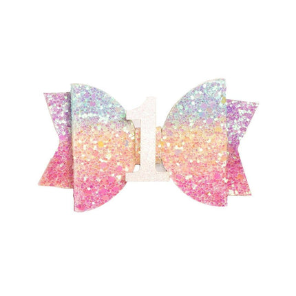Every little girl needs the perfect hair clip to complete her look! The Pastel Rainbow #1 Clip&nbsp;is the perfect hair accessory for celebrating&nbsp;a 1st birthday. Features: Pastel rainbow glitter bow with white glitter #1 Ribbon-covered alligator clip to grip the hair Glitter accents are “shed free” One size fits all Pair this hair clip with a matching Sweet Wink tutu and shirt for a complete head-to-toe outfit!
