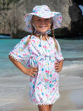 Our new beach cover-up comes in a triple brushed, extra soft and breathable fabric that will make lasting impressions. Super soft to the touch with the cutest prints, your little girl will stand out in the crowd. We're pleased to announce that it now offers UPF 50+, the highest UV protection certification which blocks 97.5% of cancer-causing UV Rays! For added sun protection, pair off with coordinating UPF 50+ Sun hats.
