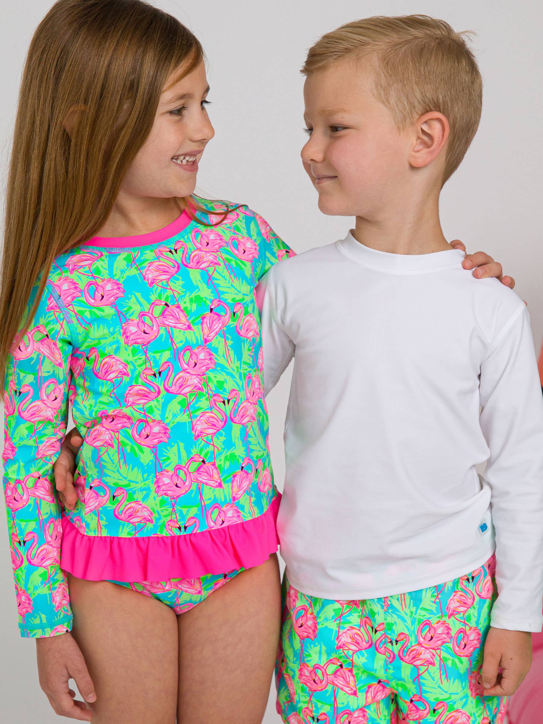Girls Neon Flamingo Fun Long Sleeve Rash Guard 2-Piece Swimsuit with Signature Rear Ruffles