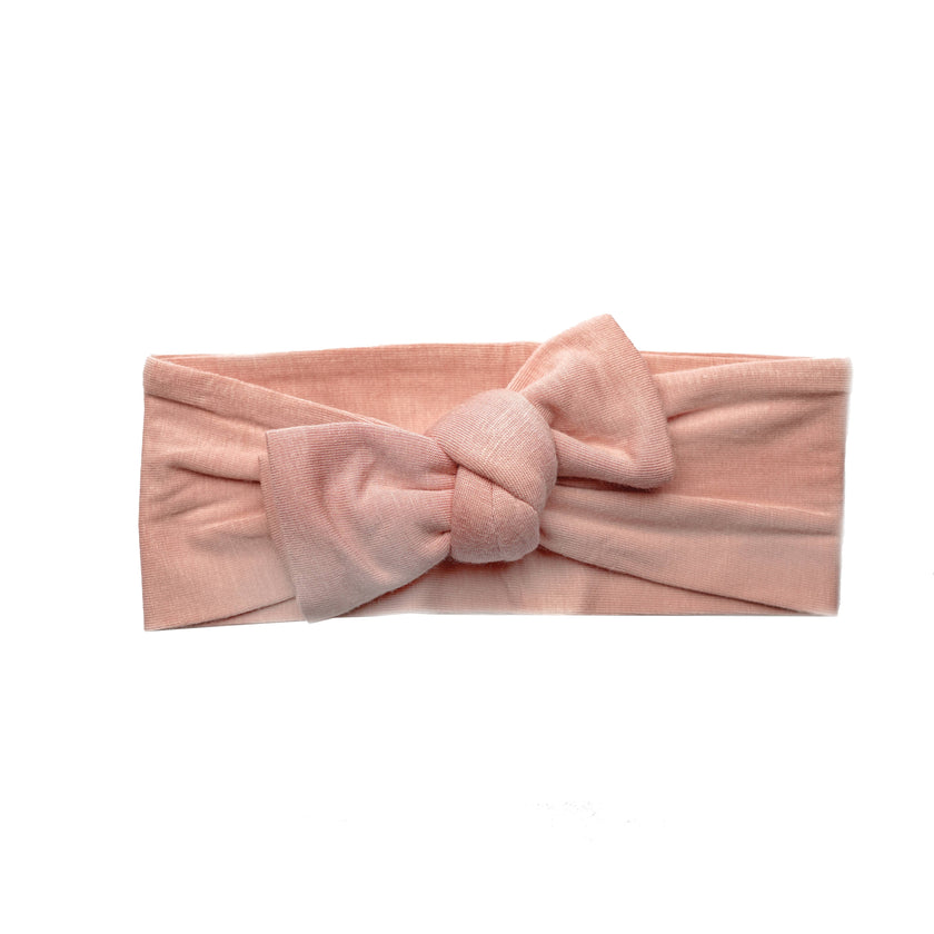 The softest bamboo baby headbands ever! Pair these adorable accessories with onesies, dresses, bloomers, and gowns for the cutest girl outfits. Color/Print: Dusty Rose Fabric: 95% Viscose from Bamboo / 5% Spandex Sizing: Size 1 (0-12M) and Size 2 (12M and up) Fit: Stretchy Wash: Hand wash / Lay flat to dry Imported
