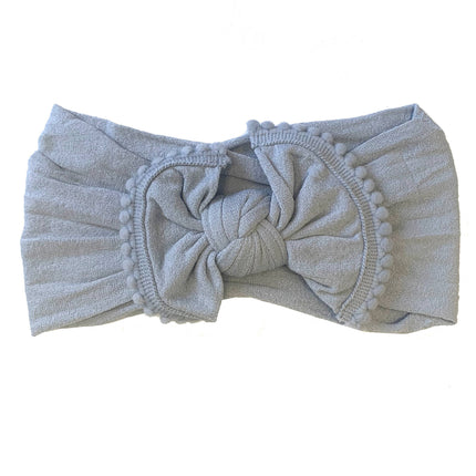 The softest baby headbands ever! Pair these adorable accessories with onesies, dresses, bloomers, and gowns for the cutest girl outfits. Color/Print: Grey Fabric: Nylon Sizing: Size 1 (0-12M) Fit: Stretchy Wash: Hand wash / Lay flat to dry Imported