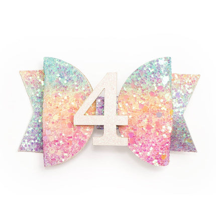 Every little girl needs the perfect hair clip to complete her look! The Pastel Rainbow #4 Clip is the perfect hair accessory for celebrating a 4th birthday. Features: Pastel rainbow glitter bow with white glitter #4 Ribbon-covered alligator clip to grip the hair Glitter accents are “shed free” One size fits all Pair this hair clip with a matching Sweet Wink tutu and shirt for a complete head-to-toe outfit!