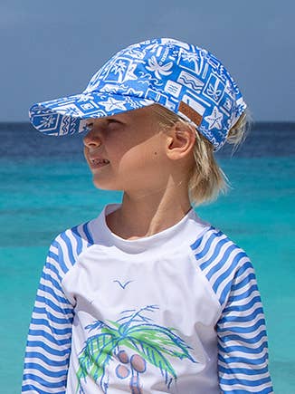 Our Flap Happy Cam-Cam Cap offers superior sun protection with a UPF 50+ rating. Its brim helps shield your face from UV rays. An adjustable snap closure ensures a comfortable fit while adventuring outdoors. The perfect addition to your Flap Happy swim and cover-up wardrobe!