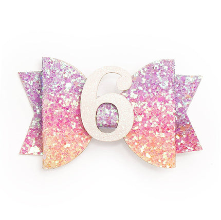 Every little girl needs the perfect hair clip to complete her look! The Pastel Rainbow #6 Clip is the perfect hair accessory for celebrating a 6th birthday. Features: Pastel rainbow glitter bow with white glitter #6 Ribbon-covered alligator clip to grip the hair Glitter accents are “shed free” One size fits all Pair this hair clip with a matching Sweet Wink tutu and shirt for a complete head-to-toe outfit!